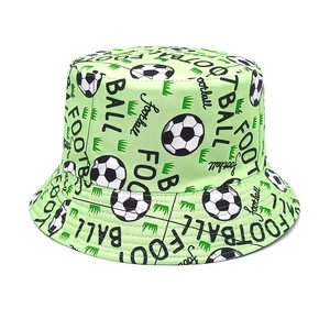 Detailed close-up of grass green bucket hat with football patterns and text design