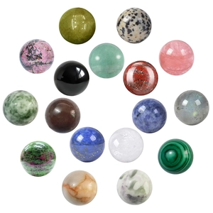 Collection of 16 natural crystal spheres in various colors and textures on white background