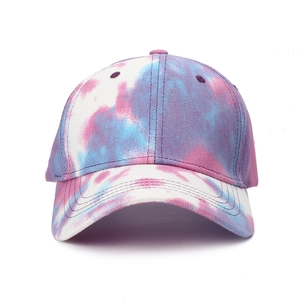 Detail of colorful pink, purple, and blue tie-dye pattern on cotton baseball cap fabric