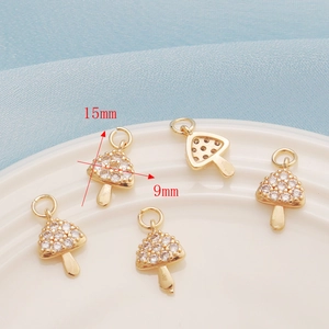 Detailed view of 15mm x 9mm gold-plated mushroom charms with zircon inlay for jewelry DIY