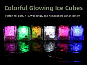 Detailed view of colorful LED glowing ice cubes set on a black surface with reflections