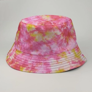 Detailed macro shot of pink and yellow tie-dye bucket hat with visible stitching and texture