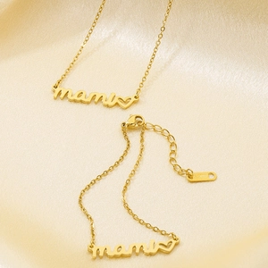 Golden stainless steel necklace and bracelet set with mami script on silk background