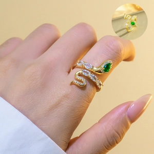 Detailed close-up of emerald green snake ring with white zircon stones on adjustable band