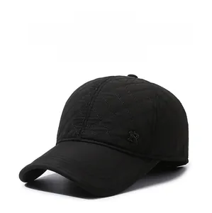 Detail of winter baseball cap with diamond quilted texture and protective earflaps