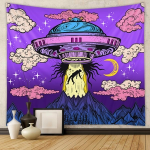 Detail of retro sci-fi tapestry featuring a UFO beam over blue mountains on white wall
