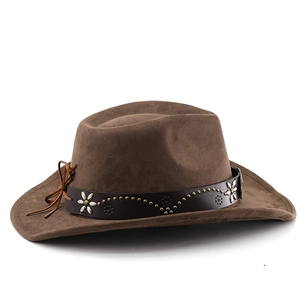 Detail of brown suede cowboy hat featuring leather band with floral metal studs