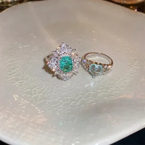 Double-layer zircon heart and emerald-cut green stone open rings in retro style
