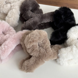 Plush cross hair claw clips in various colors like pink, beige, grey, and brown