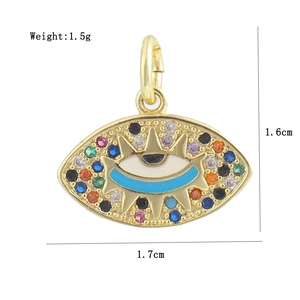 Detail view of 18K gold plated evil eye pendant with dimensions 1.7cm by 1.6cm