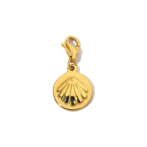 Close-up of golden shell charm with lobster clasp made of polished stainless steel