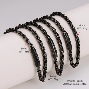 Three 6mm black braided stainless steel chains displayed on white column stands