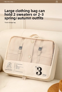 Macro detail of large pearl white travel organizer bag with mesh panel and carry handle