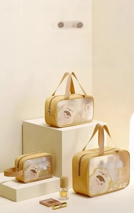 Three-piece yellow toiletry bag set with clear windows and cute toast cartoon print