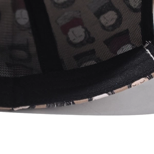 Detail shot of black breathable mesh and inner printed fabric of the trucker hat