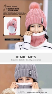 Detail of cable knit beanie with warm fleece lining and large fluffy pom-poms