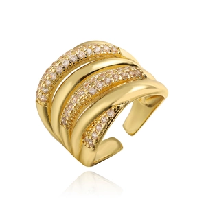 Macro view of gold multi-layer wide band ring with champagne zircon stones