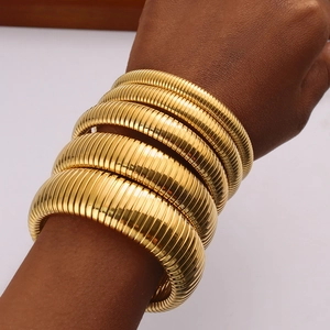 Vintage style gold striped stretch cuffs and choker necklace in polished titanium steel