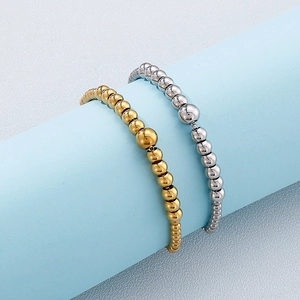 Polished adjustable beaded bracelets in gold and silver finish with gradient sized beads