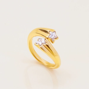 Detail of gold-plated star ring with sparkling cubic zirconia stones in a minimalist design
