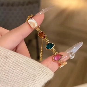 Colorful geometric glass shell bracelet with gold base and vibrant square stones