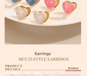 Detailed view of marble-textured enamel heart earrings in blue, pink, and white tones