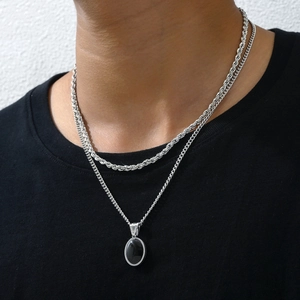 Double-layered silver necklace with twisted chain and black gemstone oval pendant for men
