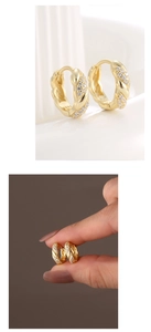 Macro detail of S925 stamped gold twist huggie earrings with cubic zirconia stones