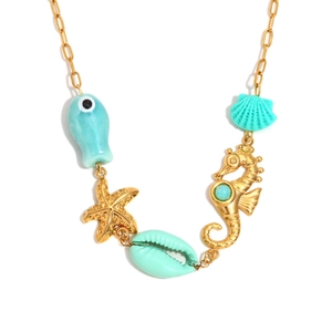 Gold plated stainless steel ocean necklace featuring turquoise fish and seahorse charms