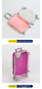 Detailed view of mini suitcase lash boxes with wheels and adjustable handles in pink and purple