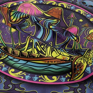 Close-up of psychedelic mushroom and skull print fabric with vibrant neon colors