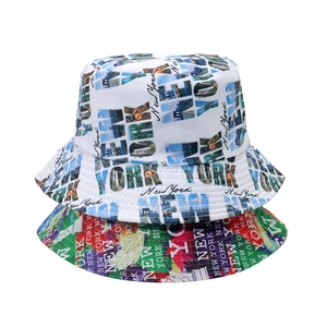 Reversible bucket hat featuring New York city print and abstract floral patterns