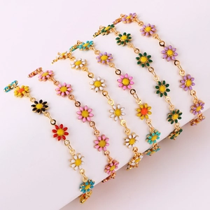 Colorful enamel daisy bracelets with 18K gold chain featuring mixed floral charms