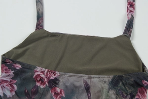 Detail of vintage floral mesh dress featuring thin straps and fine flatlock stitching