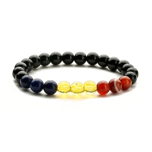 Detailed macro view of 8mm tiger eye agate crystal beads on an elastic bracelet