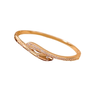 Gold-plated snake crossover bangle with zircon inlay in a luxury vintage design