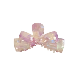 Large pale pink acetate hair claw clip with holographic pearl finish and bow design