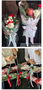 Close-up of Christmas candy-shaped gift box with pearl handle and festive bouquet packaging