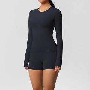 Detail of black double-sided brushed long-sleeve yoga top and high-waist tight shorts
