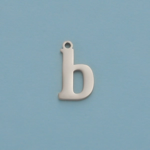 Macro detail of silver mirror-polished stainless steel letter b pendant on blue background