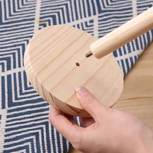 Vertical wooden paper towel holder with round base and easy screw-in assembly structure