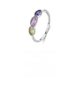 Detailed macro view of S925 sterling silver ring with triple oval colorful crystals