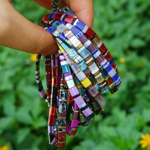 Colorful Bohemian Tila bead bracelet set with rectangular glass beads in natural sunlight