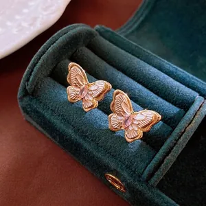 Exquisite gold-plated butterfly earrings with pink zircon stone in a velvet jewelry box