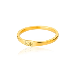 Detailed close-up of gold titanium steel ring featuring minimalist 888 number engraving