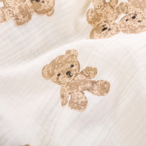 Soft muslin cotton baby blanket featuring vintage brown bear print and lace edges
