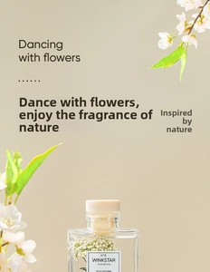 Close-up of Winkstar reed diffuser with white preserved flowers and wood cap