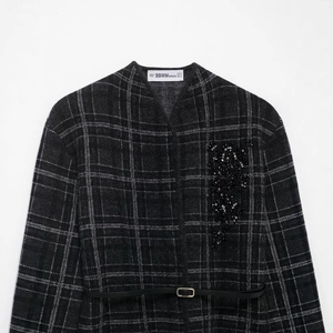 Women's grey plaid knit blazer with floral bead embroidery and a slim black waist belt