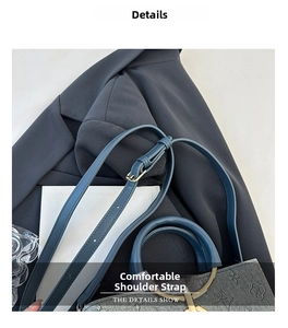 Detail of adjustable blue leather strap and gold buckle on monogram bucket bag