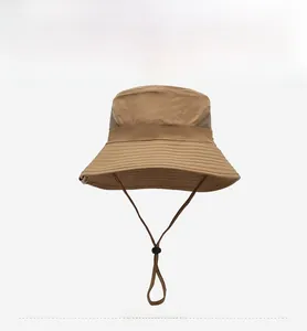 Close-up of breathable mesh vents and adjustable chin strap on khaki sun hat